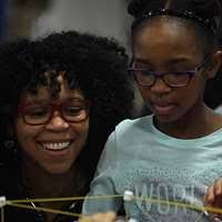 Olivia Yazikna, 8, and Conner Gant, 6, work