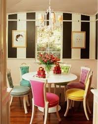 Colorful Dining Room With Multicolored Chairs Dining Room Colors Dining Room Design Apartment Dining Room