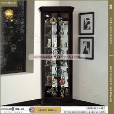 Design toscan hardwood wall curio cabinet. 680 487 Howard Miller Black Corner Curio Display Cabinet This Beautiful Corner Curio Display Cabinet S Beveled Glass Curio Cabinet Beveled Glass Doors Cabinet