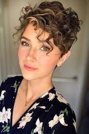 Volumized and asymmetric bob hairstyle for round face. Short Curly Haircut Round Face Short Curly Hairstyles For Women Curly Pixie Haircuts Curly Natural Curls
