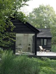 Black Cabin Large Window Rum Magazine Cabins And Cottages House Exterior Architecture