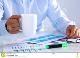 Businessman Drinking Tea At A Table In The Office Stock