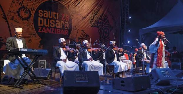Musician performing on stage representing the importance of music in cultural life