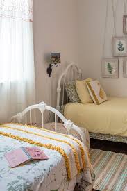 Here, the beds are pushed into the corners (not usually a problem for twin beds, as you only need access from one side) and paired with two desks, while the inhabitants' chests of drawers are together under the windows. Design Ideas For Doubling Down Rooms With Two Twin Beds Small Room Bedroom Two Twin Beds Bedroom Design