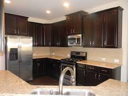 The Arlington Kitchen Timberlake Tahoe Maple Espresso Cabinets Giallo Ornamental Granite Espresso Cabinets Espresso Kitchen Cabinets Kitchen Cabinet Design