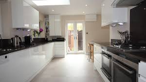 Replacing kitchen worktops can be an expensive and painstaking home improvement project. White Gloss Finish Cupboards With Dark Granite Effect Laminate Worktops Worcester Diamond Kitchens Driotwich