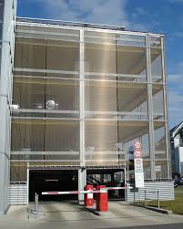 Parking Garage Mtsc Rostock Facade Cladding With Haver Architectural Mesh Doka Barrette 8914 Parking Building Facade Cladding Parking Garage