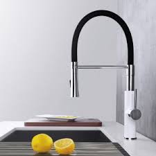 Black pearl granite countertops, oak floors and colorful tiffany ceiling light. Black Kitchen Faucet With Pull Down Syringe Arcorawasserhahn