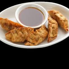 Gyoza With Cabbage Fresh Ginger Sesame Oil Ground Pork Crushed Garlic Green Onions Gyoza Wrappers Egg Whites Food Recipes Deep Fried Recipes