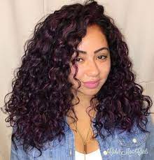 Purple curly hair is a hot fashion trend nowadays and why wouldn't it be? 50 Natural Curly Hairstyles Curly Hair Ideas To Try In 2021 Hair Adviser Curly Hair Styles Naturally Purple Hair Highlights Highlights Curly Hair