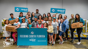 Latest photos of dolphins games, community events, and more Dolphins Cheerleaders And Junior Cheerleaders In A Dolphinshuddlefor100 Project Feeding South Florida
