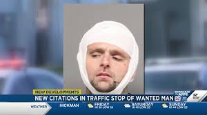 New citations in traffic stop of wanted man who was shot by officer and ran  over passenger