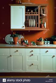 plate rack and wooden shelves on wall
