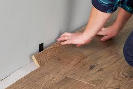 Laminate is only a replica of wood, doing its best to imitate real wood floor patterns. How To Install Laminate Wood Flooring For An Affordable Home Makeover Better Homes Gardens