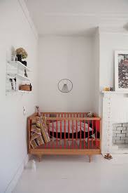 Modern Nursery With Wood Red Crib Weaving Wall Hanging Fireplace Kid Room Decor Modern Baby Room Kids Interior