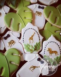 Every baby shower needs a themed drink, so why not serve up some limeade with fresh lime slices, a splash of sprite or ginger ale, and a scoop of a fruity sweet treats such as cupcakes and cookies will surely keep the jungle fever (or sugar high) going for hours after the shower! Melissa Baby Shower Giraffe Safari Cookies Baby Shower Cookies