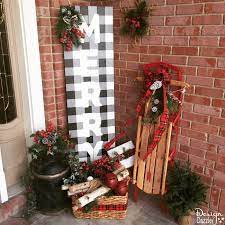 Add up some rustic look to your porch decor and flaunt it amongst your colleagues and friends. Looking For A Simple Unique Way To Decorate This Year Design Dazzle Shows You How To Paint A Christmas Signs Diy Christmas Porch Decor Christmas Decorations