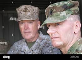 right) Command Sgt. Maj. John W. Troxell, senior enlisted adviser to the  Chairman (SEAC) of the Joint Chiefs of Staff, and Chairman of the Joint  Chiefs of Staff, Marine Gen. Joseph F.