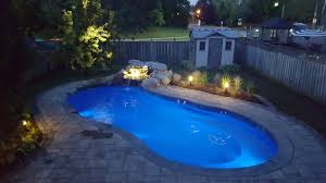 As Night Rolls In It Seems Only Logical To Feature Another Leisure Pools Riviera Fiberglass Swimming Pool Leisure Pools Pool Patio Fiberglass Swimming Pools