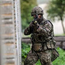 A Royal Marines Commando From X Ray Company 45 Commando In The Thick Of The Action During Training Assault Royal Marine Commando Marine Commandos Royal Marines