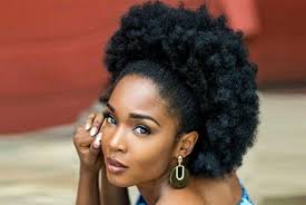 A bun like this is relaxed and stylish. The Trendiest Hairstyles For Your Natural Hair Tcb
