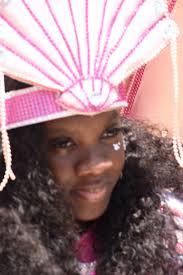 Author Jasmine Maloney holding her legal deposit, "The Pageant" along with  the workbook which were presented to the Reference Department at the  National Library Service.