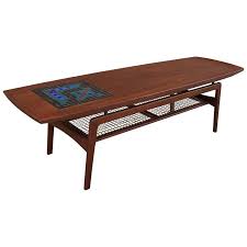 A sturdy walnut frame with slender legs makes this table the perfect addition to any home, business, or office. Danish Modern Teak And Mosaic Tile Coffee Table By Arne Hovmand Olsen At 1stdibs