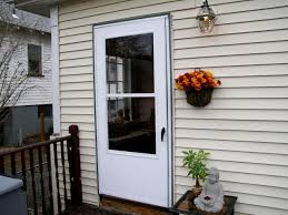 First lift your door up and down in the track. Installing A Screen Door And Replacing Lattice Hgtv