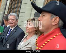 Geneva, Switzerland. 02nd Apr, 2014. The president of the state council of  the canton Geneva Francois Longchamp (L) and city guide Evelyn  Riedener-Meyer (R) lead the German president Joachim Gauck (C) and