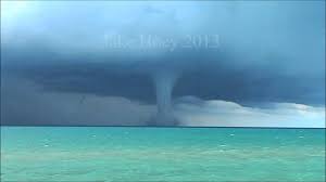 A waterspout descends from a cumulus cloud to an ocean or a lake. Watch Waterspout On Lake Michigan The Two Way Npr