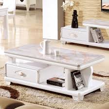 Solid wood legs are topped off by an elegant marble slab for a clean, compact look that's perfect for small spaces. China Good Price Livingroom Modern Marble Top Wooden Coffee Table China Modern Marble Top Coffee Table Modern Marble Top Wooden Coffee Table