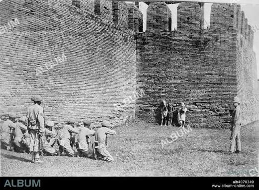 WILLOUGHBY WALLACE HOOPER. Execution of Burmese dacoits at Mandalay. A glass copy negative of a print showing three Burmese dacoits about to be executed by a British firin - Album alb4070349