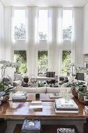 You can decorate the cathedral windows with curtains, which will probably have to be custom made for the height of your window. Decorating With Vaulted Ceilings