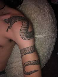 Why not have a dragon silhouette curling around your sword. My Snake Half Sleeve Done By Pete At King Pete S Tattoo In Andover Kansas Tattoo Lover Family