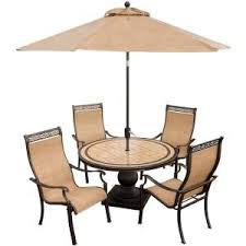 An umbrella hole in the middle of the dining table helps to install an umbrella for covering the food while eating outdoors. Hanover Monaco 5 Piece Outdoor Round Patio Dining Set And Umbrella Monaco5pc Su At The Home Depot Mobile