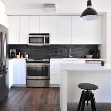 White cabinets, white counters, and white backsplash, and i love it! Cleaning House With Essential Oils Kitchens The Blend
