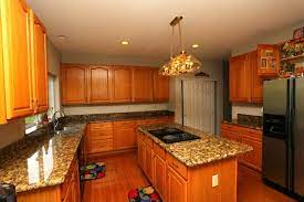 Although gray is a cool tone, it goes with everything. Oak Cabinets And Granite Yes They Blend Flawlessly