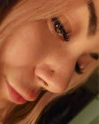 its.rose.thorne came to see me Valentines Day (thank you @doxthrasher for  bringing them in! Hehe) and we opened up an old nostril piercing and put  this CUTE yellow gold heart from @bvla