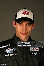 Scott Wimmer, driver of the Holiday Inn Chevrolet, poses at Daytona... News  Photo