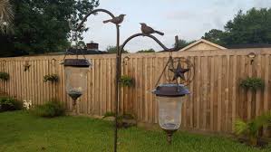 Old Candle Holders Added Solar Lights And Hung On A Double Sheppard Hook That I Bought At Aldi Foods For 3 99 Old Candles Solar Lights Candle Holders