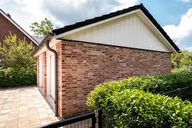 Garage Mit Schonem Klinkerstein Passend Zum Traumhaus Doppelgarage Garage Klinker Fassade Stein Auffahrt Fassade Aussenwandfarbe Hausfassade Doppelgarage