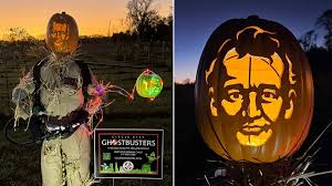 Ghostbusters scarecrow display features Slimer and the pumpkified head of  Bill Murray