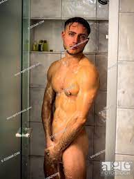 Naked Athletic Young Man Taking Shower in the Bathroom to Refresh, Looking  at Camera, Stock Photo, Picture And Low Budget Royalty Free Image. Pic.  ESY-055270399 | agefotostock