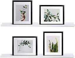 This twist on the traditional photo ledge features a top ledge with a lip to keep the frame from tipping out and falling off the shelf, which also gives it a modern cohesive art display style. Amazon Com Welland White Picture Ledge Photo Ledge Floating Ledge Wall Shelves 36 Inch Set Of 2 White Kitchen Dining