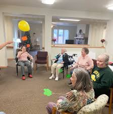 Folks gathered for a rousing game of Balloon Pong last week! Not only does  it work large muscles and hand-eye coordination, it's also just plain fun!