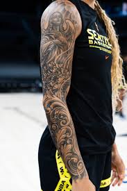 WNBA Star Gabby Williams Explains All Her Tattoos & What They Mean