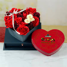 Flowers and chocolates are the ideal way to profess your deepest emotions to your special someone. Artificial Flower Box With Sapphire Box Chocolate Hampers On Birthday