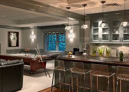 A mix of natural materials — stone columns, marble countertop, leather barstools and richly finished wood — makes this basement bar a showpiece. 27 Basement Bars That Bring Home The Good Times Home Bar Designs Basement Bar Designs Bars For Home