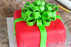 How to make a fondant gift box covered in smooth fondant icing design with bow on top sprayed in gold the bow was made for christmas gift ideas how to make. Christmas Present Cake Roxy S Kitchen