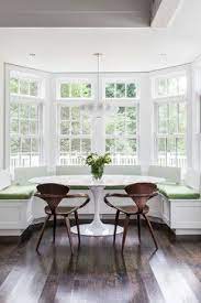This option, which you can make yourself or hire out, is great in utilitarian spaces such as mudrooms, entryways, or even a laundry area. Meadow View Residence Window Seat Kitchen Kitchen Bay Window Transitional Dining Room